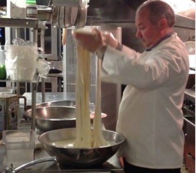 Chef making fresh mozzarella cheese